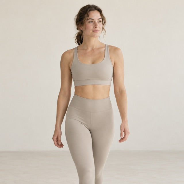Model wearing a matching sports bra and leggings set